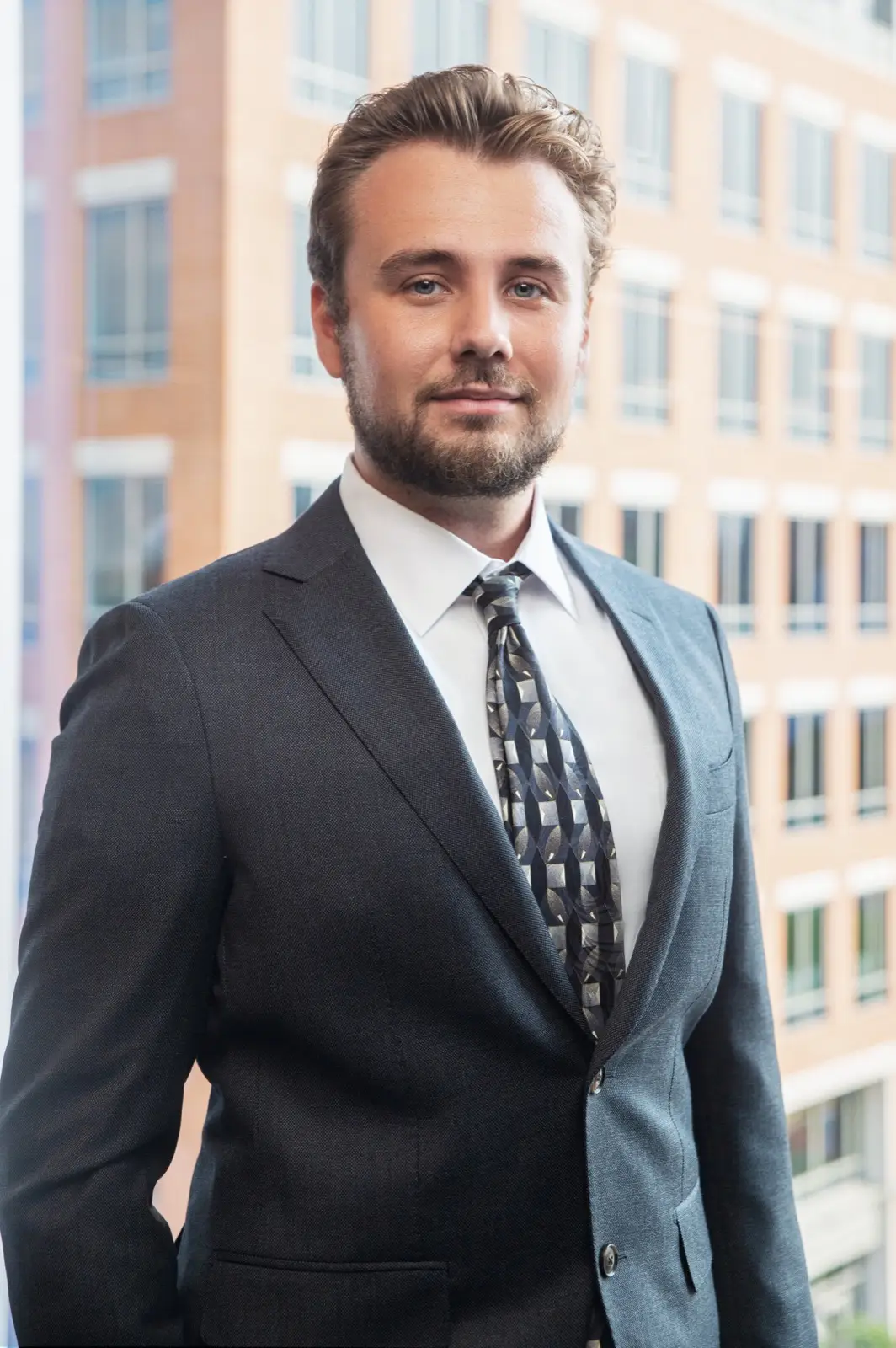 Attorney Weir King standing in a suit